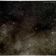 Figure 3. This dark cloud image is caused by dust particles that block out background stellar light.  The long filamentary structure towards the bottom of the picture, is TMC-1. 